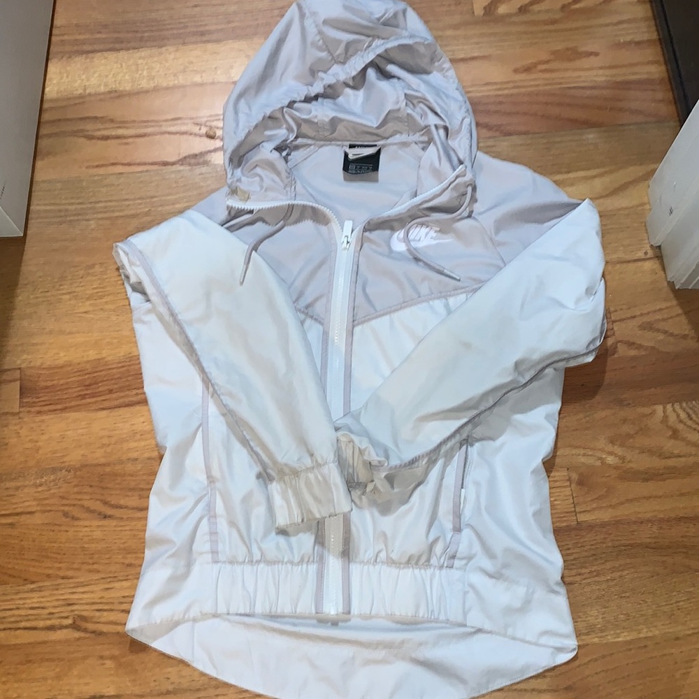 Nike women's Windrunner.   Women’s Size XS.  Color is white with light gray